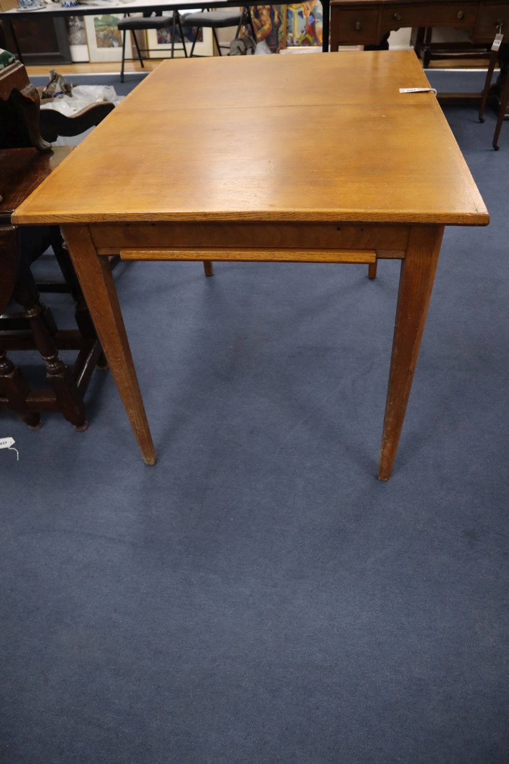 A Heals oak extending dining table, 107 x 78cm